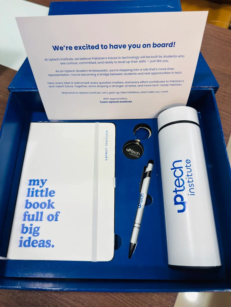 Uptech Institute merch box with notebook, pen, keychain and water bottle
